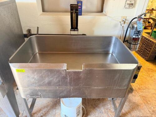 GROEN COMMERCIAL BRAISING PAN WITH TILTING MECHANISM AND INTEGRATED CONTROL HOUSING.