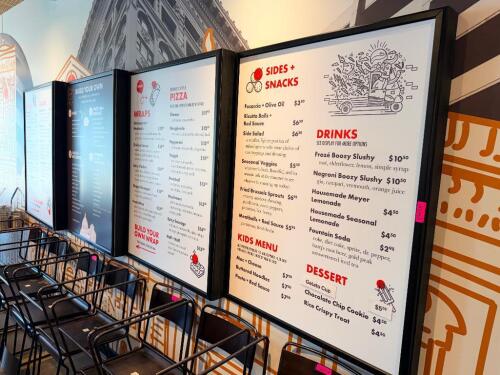 (4) LARGE OFF SET WALL-MOUNT FRAMED MENU DISPLAY BOARDS - GRAPHICS PANELS ARE REPLACEABLE.
