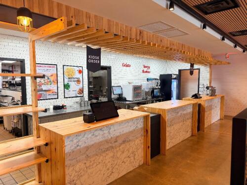 28' CUSTOM WOOD AND LAMINATE SALES / FRONT SERVICE COUNTER WITH OVERHEAD WOOD FRAME 72" LEFT SIDE SHELVING UNIT.