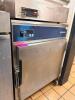 ALTO-SHAAM HALF SIZE COMMERCIAL HOLDING CABINET WITH STAINLESS STEEL EXTERIOR, SINGLE DOOR DESIGN, AND DIGITAL TEMPERATURE CONTROL PANEL.