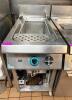 DESCO SINGLE WELL GAS PASTA COOKER WITH STAINLESS STEEL CONSTRUCTION, INTEGRATED WATER FILL FAUCET, AND BASKET INSERT. UNIT FEATURES FRONT CONTROL KNOB AND LOWER ACCESS PANEL WITH INTERNAL GAS COMPONENTS.