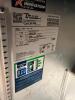 TRUE STAINLESS STEEL WORKTOP REFRIGERATOR WITH BACKSPLASH AND DOUBLE DOOR STORAGE COMPARTMENT. UNIT FEATURES SOLID DOORS WITH INTERNAL SHELVING AND REAR MOUNTED REFRIGERATION SYSTEM. - 4
