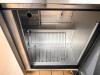 TRUE STAINLESS STEEL WORKTOP REFRIGERATOR WITH BACKSPLASH AND DOUBLE DOOR STORAGE COMPARTMENT. UNIT FEATURES SOLID DOORS WITH INTERNAL SHELVING AND REAR MOUNTED REFRIGERATION SYSTEM. - 5