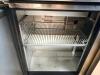 TRUE STAINLESS STEEL SANDWICH PREP TABLE WITH RAISED INGREDIENT RAIL AND DOUBLE DOOR REFRIGERATED BASE. UNIT INCLUDES OVERHEAD SHELF ASSEMBLY AND CUTTING SURFACE WITH LIFT-UP LID. - 4