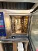 RATIONAL ICOMBI PRO COMMERCIAL COMBI OVEN WITH STAINLESS STEEL CONSTRUCTION, DIGITAL TOUCHSCREEN CONTROL, AND GLASS VIEWING DOOR. UNIT INCLUDES OVERHEAD VENT HOOD AND STAINLESS STEEL STAND WITH PAN RACK STORAGE. - 4