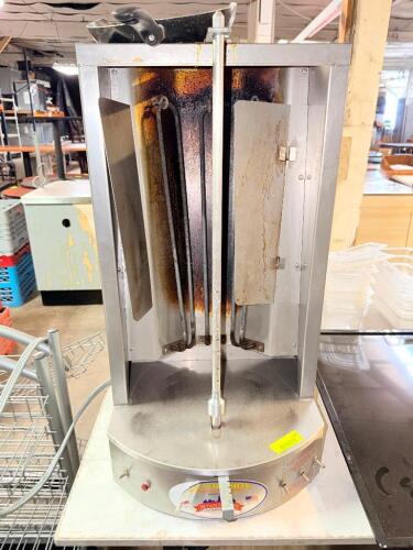 AUTOGYROS VERTICAL GYRO BROILER WITH ROTATING SPIT ASSEMBLY, DRIP TRAY, AND CONTROL SWITCHES.