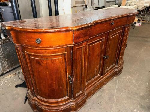 VINTAGE SERPENTINE FRONT WOOD SIDEBOARD / BUFFET WITH CURVED END CABINETS, FEATURING SOLID WOOD CONSTRUCTION, MULTI-BOARD TOP, CENTRAL DOUBLE DOOR STORAGE, AND ROUND END COMPARTMENTS WITH INTERIOR SHELVING.