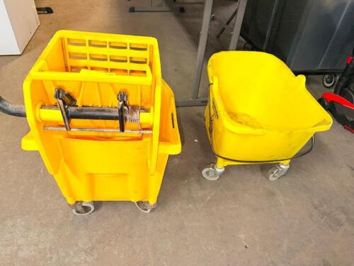 (2) MOP BUCKETS AND (4) WET FLOOR SIGNS