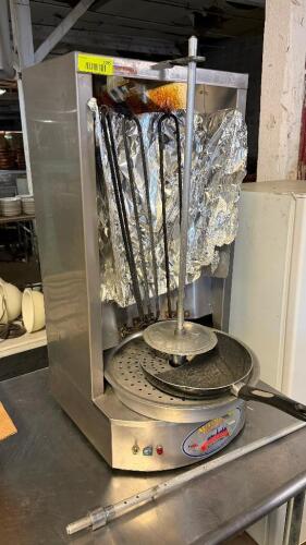 AUTOGYROS VERTICAL GYRO BROILER WITH ROTATING SPIT ASSEMBLY, DRIP TRAY, AND CONTROL SWITCHES. HAS BROKEN HEATING ELEMENT.