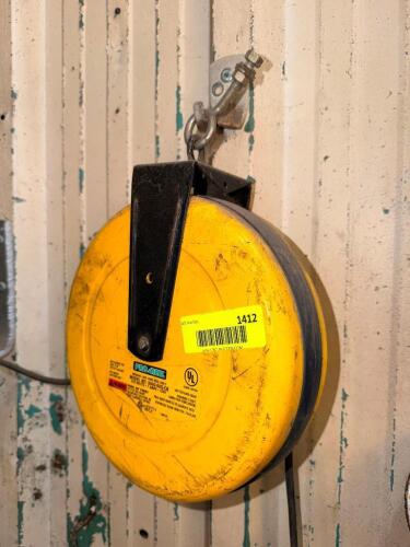WALL MOUNTED RETRACTABLE EXTENSION CORD.