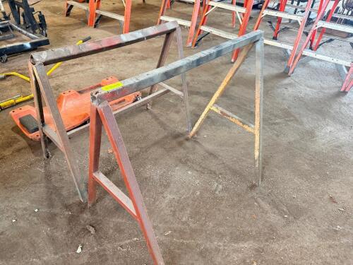 (2) METAL SAW HORSE PANEL STANDS.