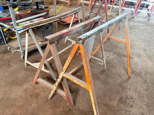 (3) METAL SAW HORSE PANEL STANDS.