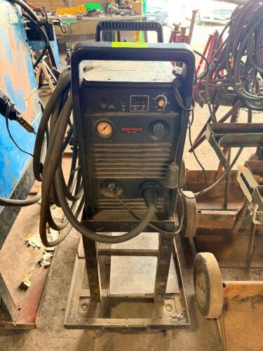 HYPERTHERM POWERMAX 900 PLASMA CUTTING SYSTEM WITH CART, LEADS, TORCH, AND BUILT-IN GAUGE, INCLUDES ATTACHED CABLES AND ACCESSORIES.