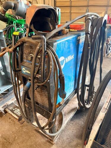 MILLER MILLER MATIC 252 MIG WELDER WITH CART, LEADS, GUN, GROUND CLAMP, REGULATOR, AND FOOT PEDAL, INCLUDES WELDING HELMET