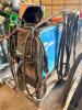 MILLER MILLER MATIC 252 MIG WELDER WITH CART, LEADS, GUN, GROUND CLAMP, REGULATOR, AND FOOT PEDAL, INCLUDES WELDING HELMET