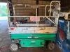 JLG ELECTRIC SCISSOR LIFT, PLATFORM WITH GUARD RAILS AND CONTROL BOX, SOLID NON-MARKING TIRES, ONBOARD CHARGER, EXTENSION DECK, SHOWS HEAVY COSMETIC WEAR WITH SCRATCHING, PAINT LOSS, AND SURFACE RUST, SUNBELT RENTAL MARKINGS, IN RUNNING CONDITION.