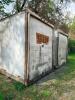 24' DRY VAN STORAGE TRAILER / VAN BODY (NO RUNNING GEAR), STEEL FRAME WITH ALUMINUM/COMPOSITE PANELS, REAR SWING DOORS, USED FOR GROUND STORAGE. UNIT SHOWS HEAVY WEATHERING, SURFACE RUST ON FRAME AND DOOR HARDWARE, AND GENERAL AGE-RELATED WEAR.