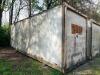 24' DRY VAN STORAGE TRAILER / VAN BODY (NO RUNNING GEAR), STEEL FRAME WITH ALUMINUM/COMPOSITE PANELS, REAR SWING DOORS, USED FOR GROUND STORAGE. UNIT SHOWS HEAVY WEATHERING, SURFACE RUST ON FRAME AND DOOR HARDWARE, AND GENERAL AGE-RELATED WEAR. - 2