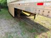 24' DRY VAN TRAILER BODY WITH ROLL-UP REAR DOOR, WOOD INTERIOR WALLS, WOOD FLOORING, AND STEEL FRAME CONSTRUCTION. UNIT SHOWS HEAVY WEAR INCLUDING RUST, CORROSION, SIDE PANEL DAMAGE, AND WEATHERING. REAR LIGHTING PRESENT, SINGLE AXLE CONFIGURATION, AND EX - 5