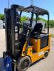 CATERPILLAR FORKLIFT WITH SOLID TIRES, OVERHEAD GUARD, SIDE BATTERY COMPARTMENT, MULTI-STAGE MAST, FORK ATTACHMENT WITH SIDE PLATE, OPERATOR SEAT WITH CONTROLS, DASH DISPLAY, HOUR METER 3468.6 HOURS - 3