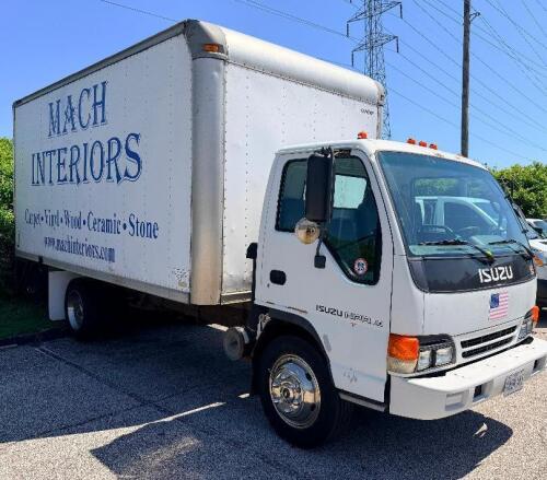 ISUZU BOX TRUCK WITH ENCLOSED CARGO BODY, WOOD FLOORING, INTERIOR SIDE RAILS, ROLL-UP REAR DOOR, TUCK-AWAY LIFTGATE (1500 LB. CAPACITY), STEEL WHEELS, CAB OVER DESIGN, CLOTH SEATS, DASH CONTROLS, ODOMETER 183,489 MILES