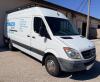 MERCEDES-BENZ WHITE CARGO VAN WITH HIGH ROOF, REAR CARGO AREA, BULKHEAD PARTITION, ROOF LADDER RACK, TOW HITCH, STEEL WHEELS, CLOTH SEATS WITH COVERS, POWER WINDOWS/MIRRORS, DASH DISPLAY, EMISSIONS MODIFICATION LABEL PRESENT, ODOMETER 195,908 MILES
