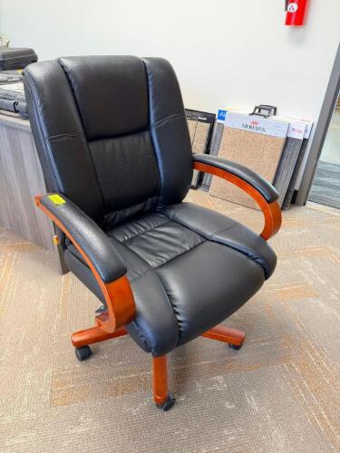 ROLL ABOUT BLACK EXECUTIVE OFFICE CHAIR W/ WOODEN ACCENTS.