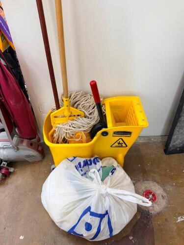 MOP BUCKET, MOP, AND ASSORTED CLEANING RAGS.
