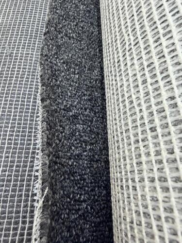 (2) ROLLS OF COMMERCIAL GRADE CARPETING IN DARK GREY WITH LOOP PILE CONSTRUCTION, BACKED WITH GRID MESH