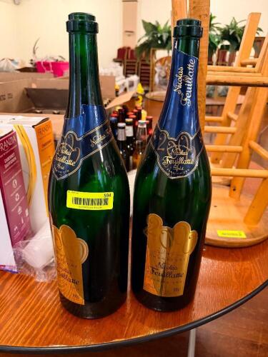 (2) EMPTY BOTTLES OF CHAMPAGNE.