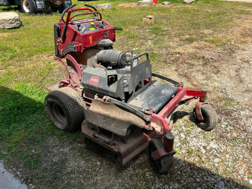TORO GRANDSTAND COMMERCIAL WALK-BEHIND MOWER WITH SIDE DISCHARGE DECK, PNEUMATIC TIRES, OPERATOR PLATFORM, AND CONTROL PANEL ( NOT IN WORKING ORDER )