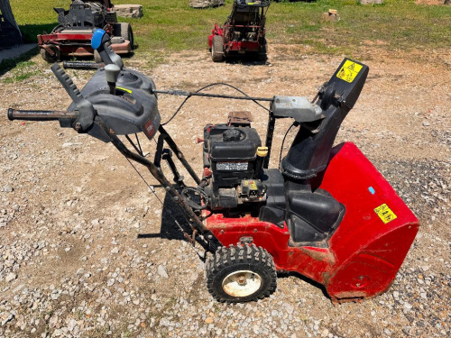 TORO POWER MAX TWO-STAGE SNOW BLOWER WITH GAS ENGINE, MANUAL CONTROLS, AUGER AND IMPELLER SYSTEM.