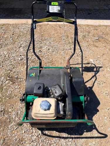 RYAN WALK-BEHIND POWER AERATOR WITH STEEL FRAME, DRUM-MOUNTED CORING TINES, AND MANUAL HANDLE CONTROLS