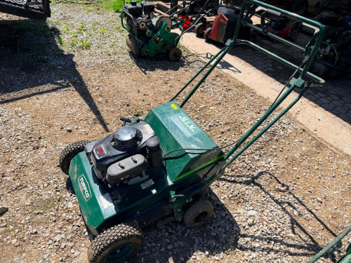 TURFCO WALK-BEHIND TURF AERATOR UNIT WITH HONDA GXV160 ENGINE, MANUAL PUSH CONFIGURATION, METAL FRAME CONSTRUCTION, CONTROL HANDLE WITH ENGAGEMENT LEVER.