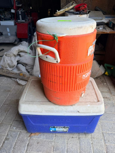 5 GALLON WATER COOLER AND (1) SMALL BLUE PLASTIC COOLER.