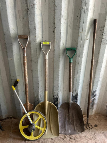 (1) MEASURING WHEEL (2) SCOOP SHOVELS (1)DIGGIN SHOVEL AND (1) PITCHFORK