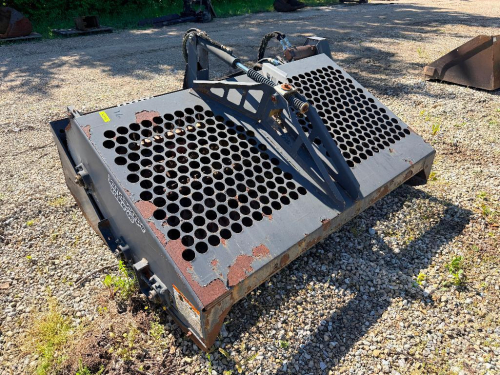 INGERSOLL RAND SKID STEER LANDSCAPE RAKE ATTACHMENT WITH HYDRAULIC ANGLE ADJUSTMENT, FULL WIDTH DRUM WITH CARBIDE TEETH, AND PERFORATED TOP SCREEN. FEATURES QUICK ATTACH MOUNT, SIDE PLATES, AND HYDRAULIC MOTOR DRIVE.