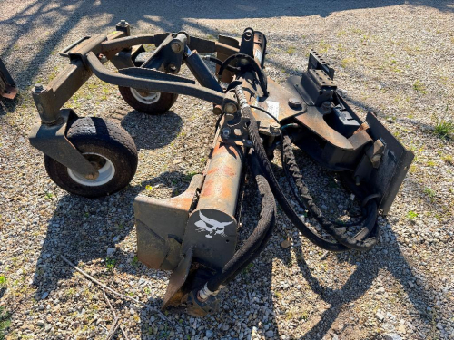 BOBCAT SKID STEER HYDRAULIC SOIL CONDITIONER / HARLEY RAKE STYLE ATTACHMENT WITH ANGLE FRAME AND GAUGE WHEELS. UNIT FEATURES FRONT LEVELING BLADE, CARBIDE-TOOTH DRUM, AND FULL HYDRAULIC CONTROLS.