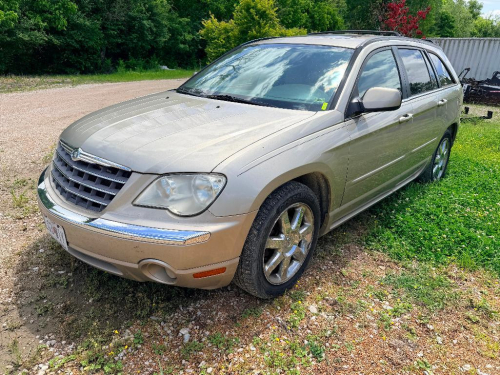 CHRYSLER STATION WAGON WITH AUTOMATIC TRANSMISSION, ROOF RACK, ALLOY WHEELS, AND LEATHER INTERIOR.