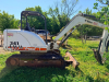 BOBCAT COMPACT EXCAVATOR WITH OPEN CAB, RUBBER TRACKS, FRONT BLADE, AND BUCKET ATTACHMENT. - 2