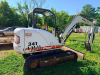 BOBCAT COMPACT EXCAVATOR WITH OPEN CAB, RUBBER TRACKS, FRONT BLADE, AND BUCKET ATTACHMENT. - 5