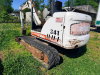BOBCAT COMPACT EXCAVATOR WITH OPEN CAB, RUBBER TRACKS, FRONT BLADE, AND BUCKET ATTACHMENT. - 6