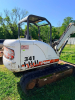 BOBCAT COMPACT EXCAVATOR WITH OPEN CAB, RUBBER TRACKS, FRONT BLADE, AND BUCKET ATTACHMENT. - 7