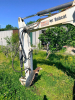 BOBCAT COMPACT EXCAVATOR WITH OPEN CAB, RUBBER TRACKS, FRONT BLADE, AND BUCKET ATTACHMENT. - 9
