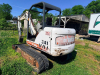 BOBCAT COMPACT EXCAVATOR WITH OPEN CAB, RUBBER TRACKS, FRONT BLADE, AND BUCKET ATTACHMENT. - 11