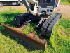 BOBCAT COMPACT EXCAVATOR WITH OPEN CAB, RUBBER TRACKS, FRONT BLADE, AND BUCKET ATTACHMENT. - 12