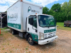 2012 ISUZU CAB OVER BOX TRUCK WITH ENCLOSED CARGO BODY, ROLL-UP REAR DOOR, AND REAR RAMP GATE. UNIT - 9
