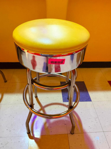 (2) RETRO-STYLE COMMERCIAL BAR STOOL WITH PADDED YELLOW VINYL SEAT.