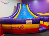 COMMERCIAL INFLATABLE SLIPPERY SLOPE SLIDE WITH PADDED ENTRY, HIGH SIDEWALLS, AND ENCLOSED LANDING AREA. UNIT FEATURES MULTI-COLOR VINYL CONSTRUCTION WITH TOP SAFETY NETTING. - 4