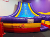 COMMERCIAL INFLATABLE SLIPPERY SLOPE SLIDE WITH PADDED ENTRY, HIGH SIDEWALLS, AND ENCLOSED LANDING AREA. UNIT FEATURES MULTI-COLOR VINYL CONSTRUCTION WITH TOP SAFETY NETTING. - 5